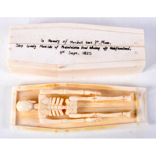 829 - A CARVED BONE COFFIN COMPLETE WITH A SKINNY OCCUPANT.  11.5cm x 2.8cm x 4.3cm