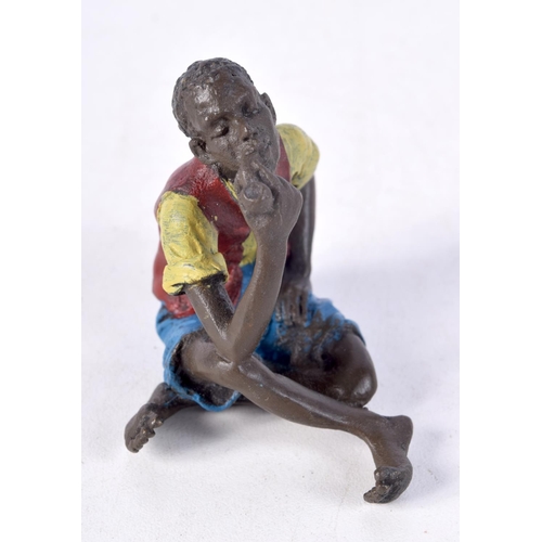 833 - A COLD PAINTED BRONZE FIGURE OF A SEATED TUNISIAN MALE SMOKING A PIPE.  5.6cm x 5.8cm x 4cm