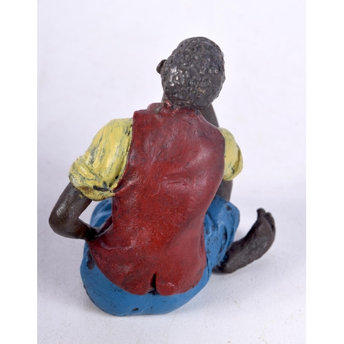 833 - A COLD PAINTED BRONZE FIGURE OF A SEATED TUNISIAN MALE SMOKING A PIPE.  5.6cm x 5.8cm x 4cm