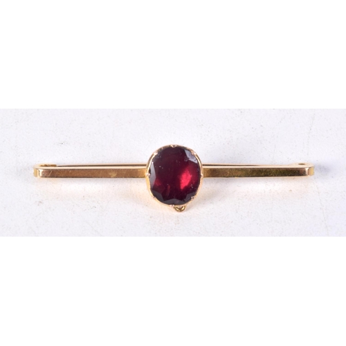 836 - A 9CT GOLD BAR BROOCH SET WITH A GARNET.  Stamped 9K, 4.4cm x 1cm, weight 2.5g