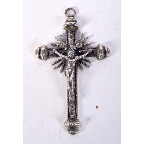 845 - THREE WHITE METAL CRUCIFIXES OF VARIOUS FORMS.  Largest 9.5cm x 5.6cm, total weight 93.1g