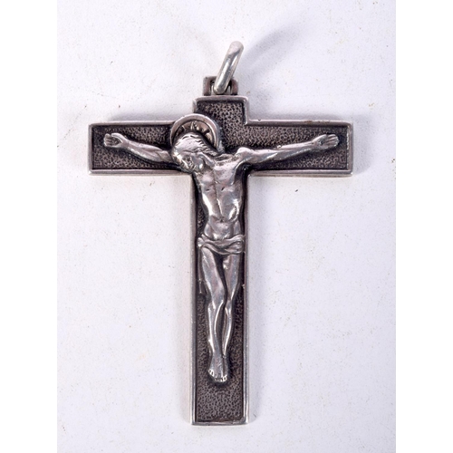 845 - THREE WHITE METAL CRUCIFIXES OF VARIOUS FORMS.  Largest 9.5cm x 5.6cm, total weight 93.1g