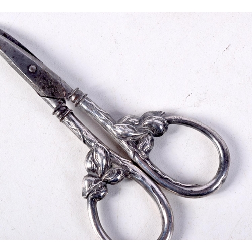 864 - FOUR WHITE METAL OBJECTS.  Scissors 9.7cm x 5cm, total weight 34.35g