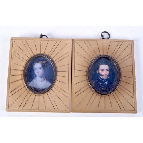 877 - A PAIR OF CONTEMPORARY PORTRAIT MINIATURES.  9.5cm x 8cm (2)