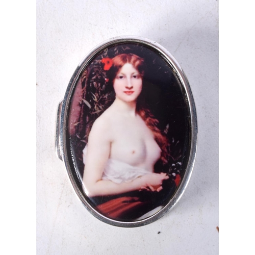 878 - A CONTINENTAL SILVER PILL BOX DECORATED WITH A NUDE FEMALE.  Stamped Sterling, 1.2cm x 3.7cm x 2.8cm... 