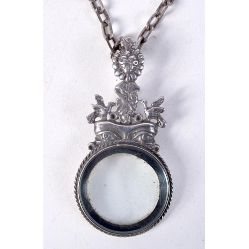 879 - A CONTINENTAL SILVER MAGNIFYING GLASS ON A CHAIN.  Magnifier stamped 900, Chain 72cm, Pendant 6.6cm ... 