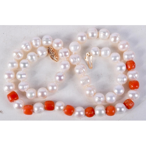 882 - A CORAL AND PEARL NECKLACE WITH A 14CT GOLD CLASP.  Stamped 14K, Length 40cm, Pearl size 6.5mm