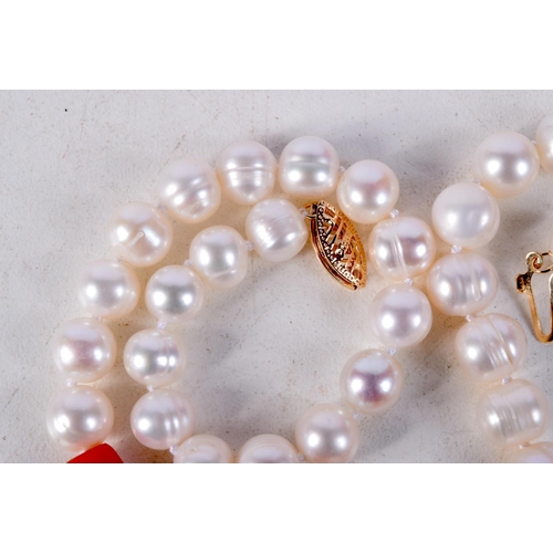 882 - A CORAL AND PEARL NECKLACE WITH A 14CT GOLD CLASP.  Stamped 14K, Length 40cm, Pearl size 6.5mm