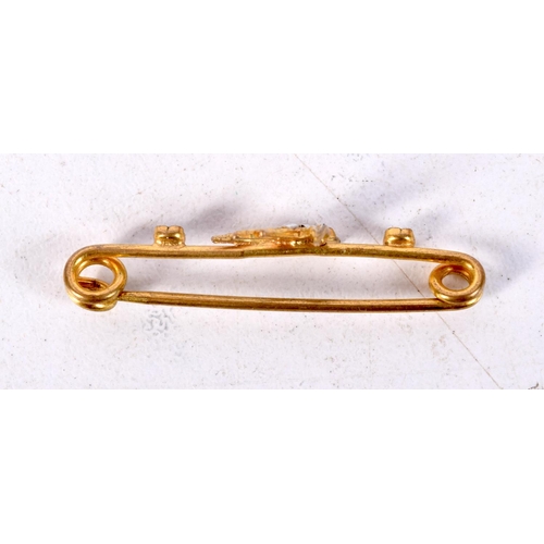 888 - A VICTORIAN BAR BROOCH WITH A SWALLOW AND SET WITH GEMS.  3.3cm x 1cm, weight 1g