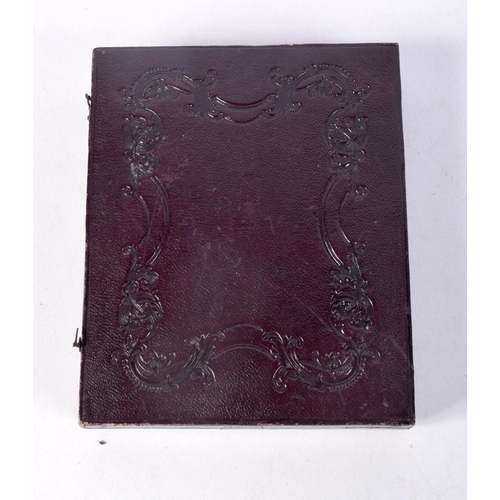 890 - A LEATHER BOUND CASED PAIR OF TINTED DAGUERREOTYPES OF A SEATED VICTORIAN GENTLEMAN AND HIS WIFE.  1... 