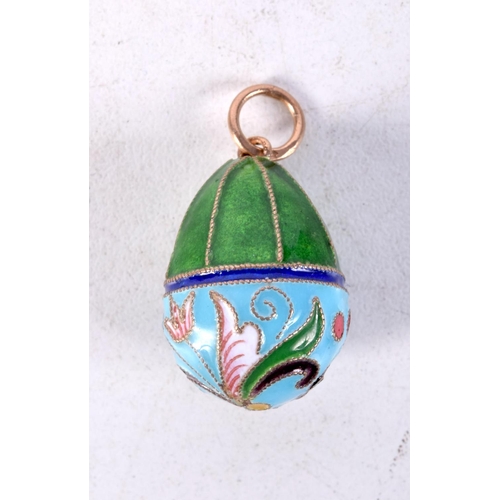 897 - A CONTINENTAL SILVER AND ENAMEL EGG PENDANT.  Stamped 84, 2.5cm x 1.6cm, weight 5.7g