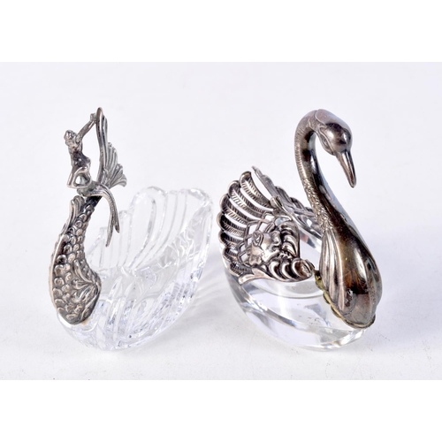 902 - TWO GLASS TABLE SALTS WITH WHITE METAL FITTINGS.  MODELLED AS A DOLPHIN AND A SWAN.  7cm x 7cm x 4cm... 