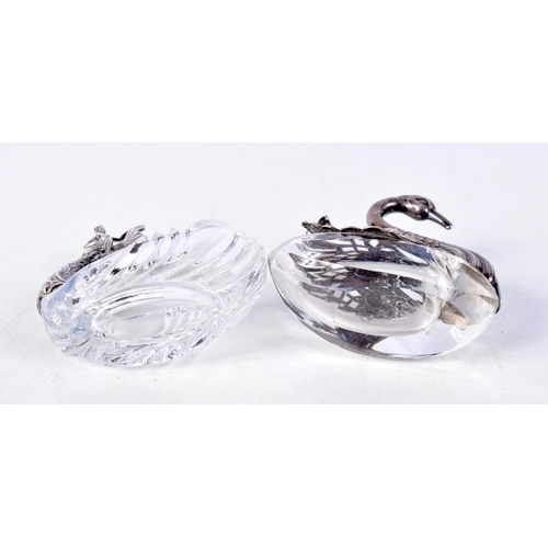 902 - TWO GLASS TABLE SALTS WITH WHITE METAL FITTINGS.  MODELLED AS A DOLPHIN AND A SWAN.  7cm x 7cm x 4cm... 