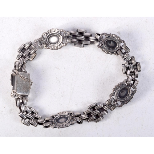 907 - A GEM SET LINK BRACELET.  5cm internal diameter. Weight 19.4g