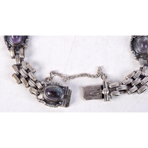 907 - A GEM SET LINK BRACELET.  5cm internal diameter. Weight 19.4g