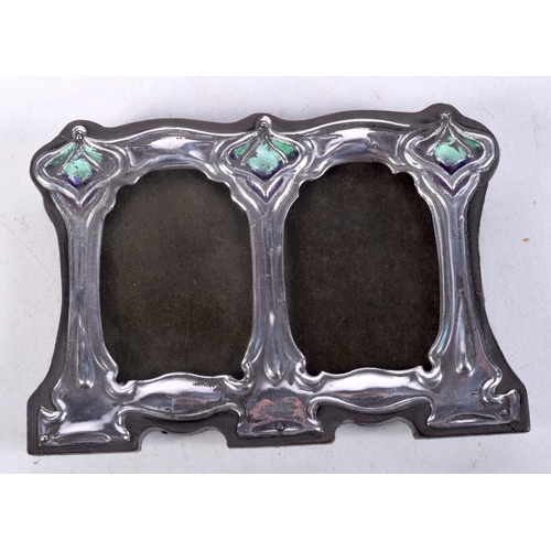 911 - AN ART NOVEAU STYLE SILVER AND ENAMEL DOUBLE PHOTO FRAME.  Stamped Sterling, 7.9cm x 11.1cm