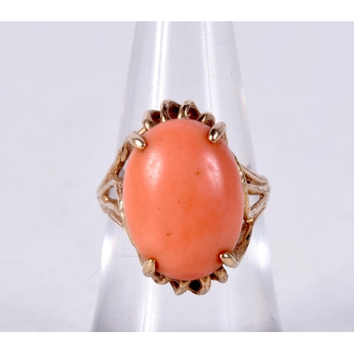 917 - A 10CT GOLD AND CORAL RING.  Stamped 10K, Size L. weight 4.9g