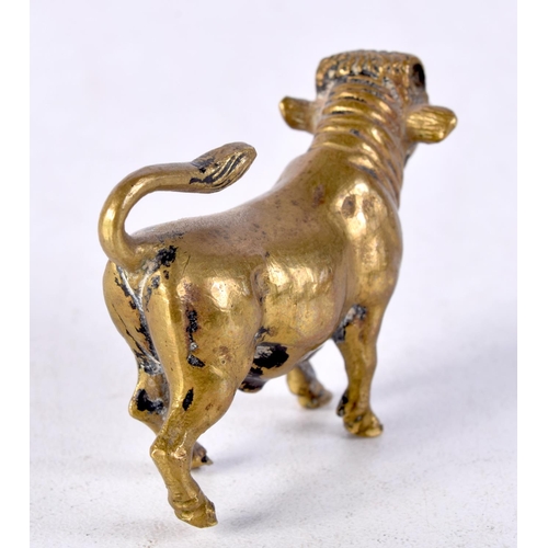 929 - AN 18TH/19TH CENTURY BRONZE FIGURE OF A BULL. 5 cm x 3.25 cm.