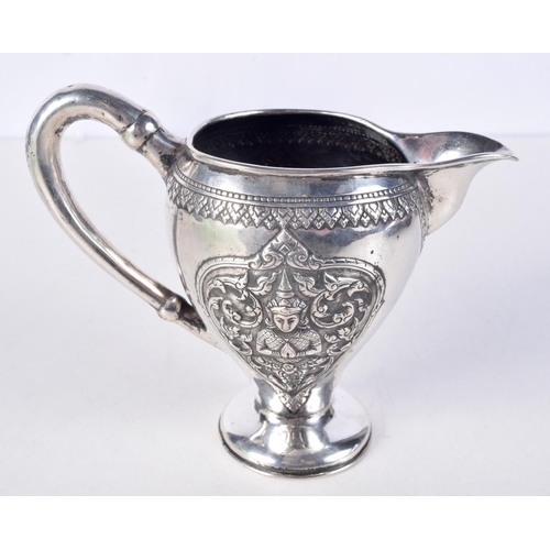 931 - A 19TH CENTURY SOUTH EAST ASIAN CHINESE TIBETAN SILVER JUG decorated with buddhistic figures. 153 gr... 