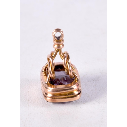 949 - AN ANTIQUE YELLOW METAL AMETHYST FOB SEAL. 3.5 grams. 2 cm x 1.5 cm.