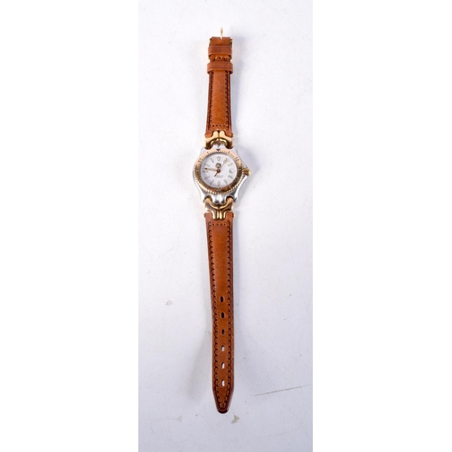 963 - A LADIES TAGHEUR WRISTWATCH. 3 cm wide inc crown.