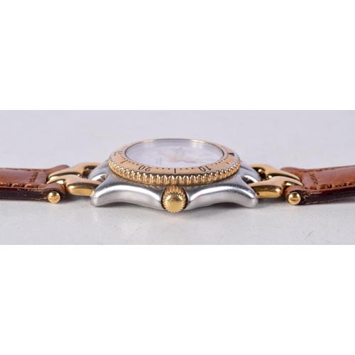 963 - A LADIES TAGHEUR WRISTWATCH. 3 cm wide inc crown.