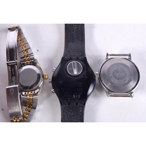 980 - THREE WATCHES. 4 cm wide. (3)