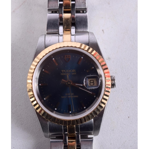 981 - A LADIES TUDOR TWO TONE BLUE DIAL WRISTWATCH. 2.5 cm wide.