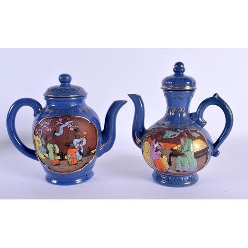 1501 - AN UNUSUAL PAIR OF JAPANESE TAISHO PERIOD NIKKI COMPANY LTD POTTERY TEAPOTS decorated with figures. ... 