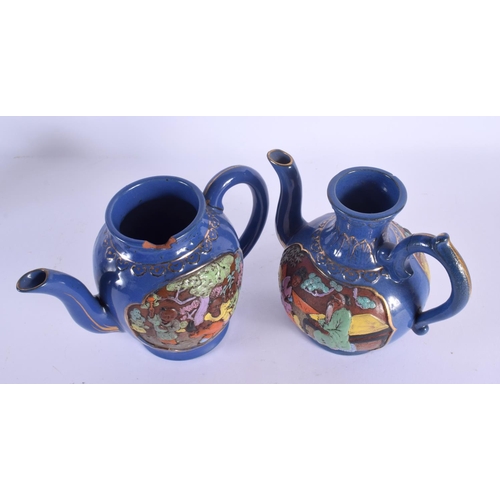 1501 - AN UNUSUAL PAIR OF JAPANESE TAISHO PERIOD NIKKI COMPANY LTD POTTERY TEAPOTS decorated with figures. ... 