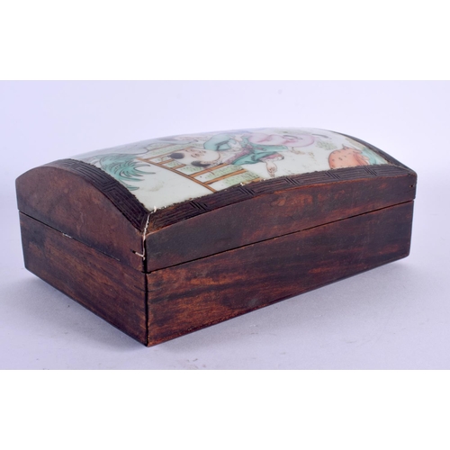 1522 - AN EARLY 20TH CENTURY CHINESE PORCELAIN INSET HARDWOOD BOX AND COVER Guangxu, painted with boys. 19 ... 