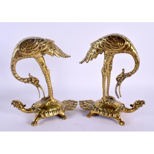 1525 - A PAIR OF 19TH CENTURY JAPANESE MEIJI PERIOD POLISHED BRONZE FIGURES modelled as birds upon minogame... 