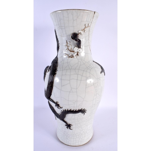 1527 - A LARGE 19TH CENTURY CHINESE CRACKLE GLAZED STONEWARE VASE Qing, overlaid with dragons. 45 cm x 18 c... 