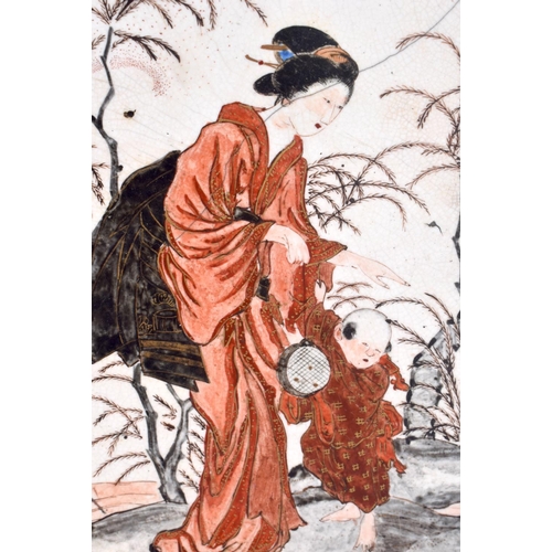 1535 - A LARGE 19TH CENTURY JAPANESE MEIJI PERIOD KUTANI DISH painted with a geisha and child within a land... 