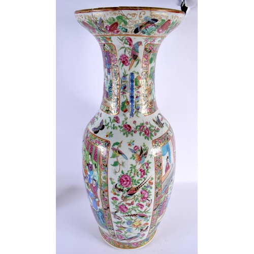 1538 - A LARGE 19TH CENTURY CHINESE CANTON FAMILLE ROSE PORCELAIN VASE painted with figures in interiors. 6... 