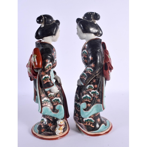 1554 - A LARGE PAIR OF 19TH CENTURY JAPANESE MEIJI PERIOD IMARI FIGURES modelled in robes beside cats. 36 c... 