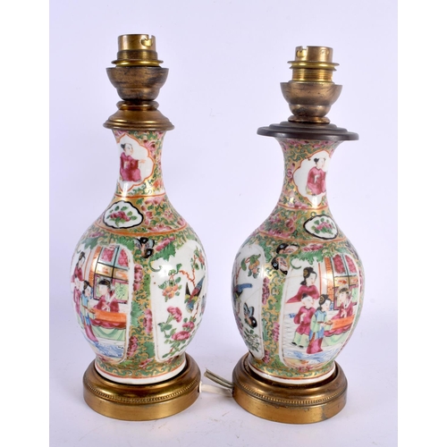 1560 - A PAIR OF 19TH CENTURY CHINESE CANTON FAMILLE ROSE COUNTRY HOUSE LAMPS Qing. 23 cm high.