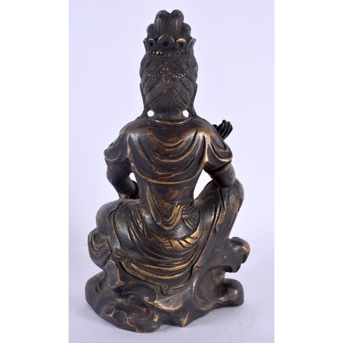 1571 - A 19TH CENTURY CHINESE BRONZE FIGURE OF A SEATED FEMALE DEITY modelled with one hand raised. 17 cm x... 