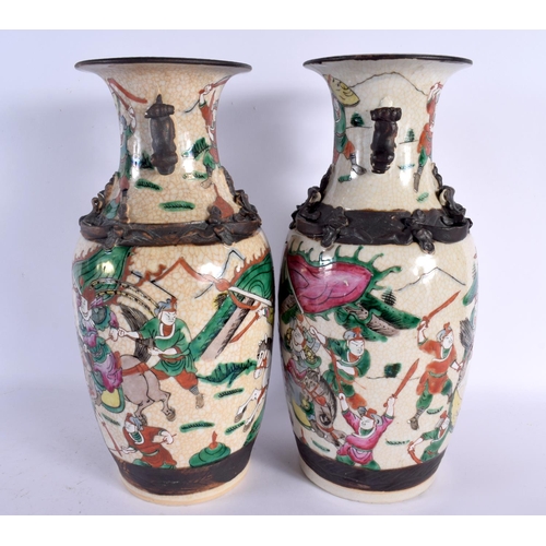 1590 - A LARGE PAIR OF 19TH CENTURY CHINESE CRACKLE GLAZED FAMILLE VERTE VASES painted with warriors in bat... 