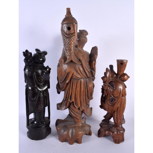 1593 - FOUR LARGE 19TH CENTURY CHINESE CARVED HARDWOOD FIGURES Qing. Largest 46 cm high. (4)