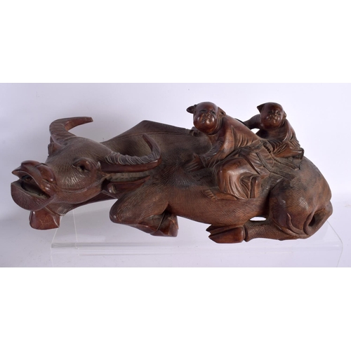 1596 - A LARGE 19TH CENTURY CHINESE CARVED HARDWOOD FIGURE together with a buffalo etc. Largest 34 cm high.... 