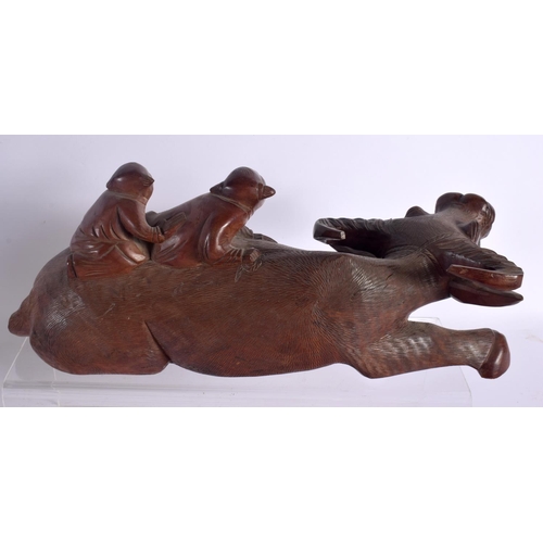 1596 - A LARGE 19TH CENTURY CHINESE CARVED HARDWOOD FIGURE together with a buffalo etc. Largest 34 cm high.... 