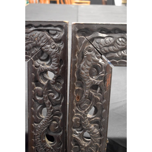 1609 - A LARGE PAIR OF 19TH CENTURY CHINESE CARVED WOOD DRAGON FRAMES Qing. 117 cm x 70 cm.