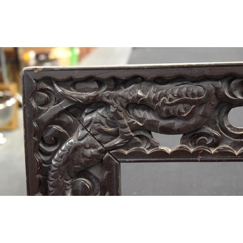 1609 - A LARGE PAIR OF 19TH CENTURY CHINESE CARVED WOOD DRAGON FRAMES Qing. 117 cm x 70 cm.