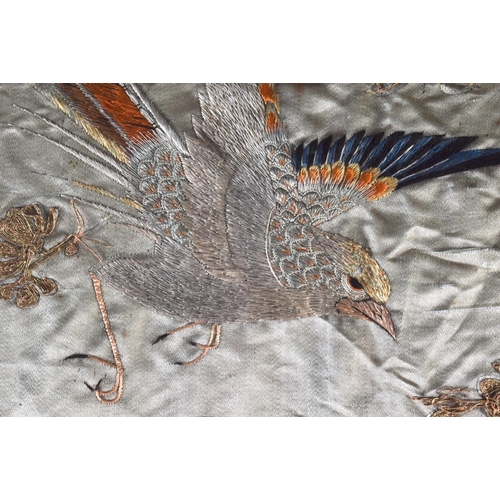 1615 - A LARGE 19TH CENTURY JAPANESE MEIJI PERIOD FRAMED SILK WORK PANEL depicting birds. 130 cm x 54 cm.