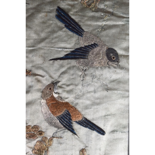 1615 - A LARGE 19TH CENTURY JAPANESE MEIJI PERIOD FRAMED SILK WORK PANEL depicting birds. 130 cm x 54 cm.