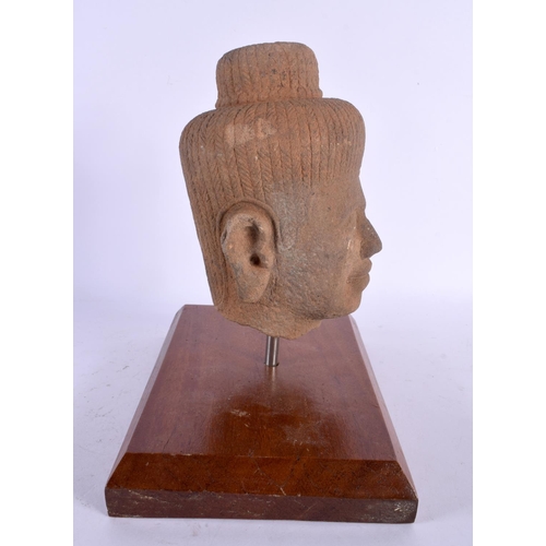 1628 - A SOUTH EAST ASIAN CARVED STONE CAMBODIAN BUDDHA HEAD. 24 cm x 16 cm.