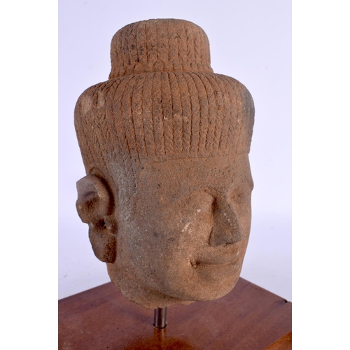 1628 - A SOUTH EAST ASIAN CARVED STONE CAMBODIAN BUDDHA HEAD. 24 cm x 16 cm.