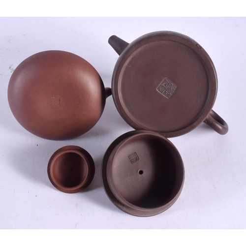 1631 - TWO CHINESE YIXING POTTERY TEAPOTS AND COVER 20th Century. Largest 14 cm wide. (2)