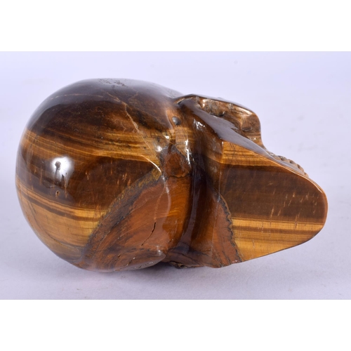 1635 - A CHINESE CARVED TIGERS EYE SKULL 20th Century. 8 cm x 6 cm.